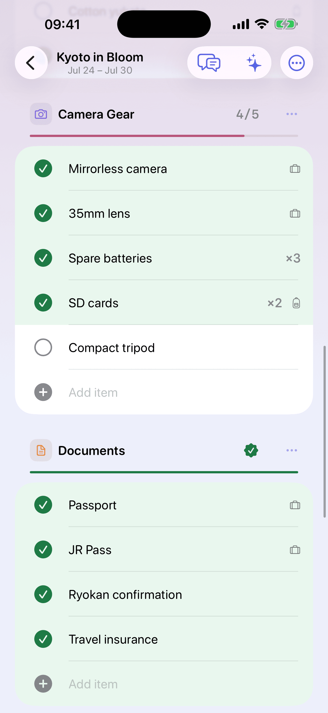 A trip's packing checklist — a partial category above a completed one sealed green as a single piece